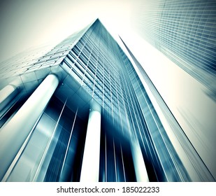 Panoramic and prospective wide angle view to steel light blue background of glass high rise building skyscraper, commercial modern city of future Business concept of successful industrial architecture - Powered by Shutterstock