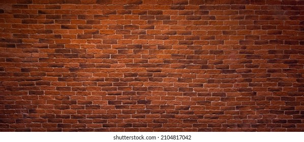 Panoramic Red Brick Wall Header Background. Vintage Brickwall Texture. Decorative Brick Wall in Room Interior. Loft concept. Beautiful Wide Angle Web banner or Wallpaper With Copy Space For Design