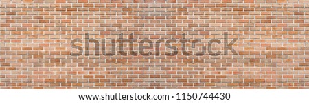 Panoramic red orange old brick wall pattern texture background. Wide panorama of masonry