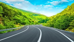 Panoramic Road Landscape Among Green Mountains. View Of Asphalt Road In Beautiful Nature Landscape. Road View In The Beautiful Nature Of Europe. Bavaria, Germany.