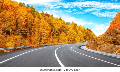 panoramic road view in the forest in autumn season. beautiful road landscape surrounded by colorful trees in fall season. Autumn landscape on highway in mountains. Autumn colors on beautiful forest. - Powered by Shutterstock