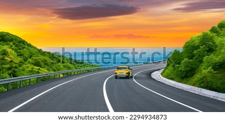 Panoramic road view on the Mediterranean coast of Europe. Car going on highway at colorful sunset. Car driving on the road. panoramic highway landscape on the beach. nature scenery on beautiful road.