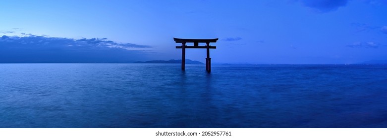Panoramic scenery of the Torii on the lake before dawn at Shiga