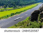 Panoramic scenic view vintage steam paddle boat cruising Elbe river curve at Sachsische Schweiz National Park Germany from Bastei Sandstone mountain valley. Europe travel nature landscape destination