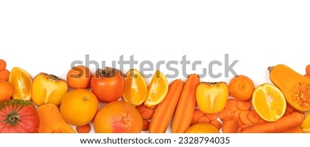 Panoramic set of ripe, juicy orange color fruits and vegetables on white background with copy space. Carrot, orange, persimmon, pumpkin, mandarin, grapefruit