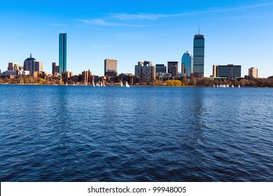 Panoramic shot of Boston in Massachusetts by the Charles River bed on a sunny spring day.