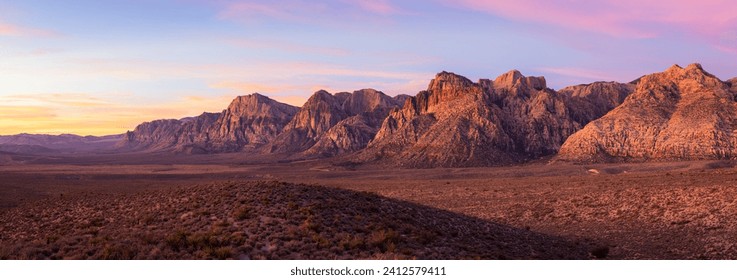 A panoramic shot of Red Rock Canyon at colorful sunrise near Las Vegas, Nevada - Powered by Shutterstock