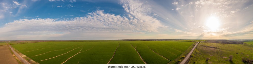 Panoramic Shot Of Soil Erosion Caused By Water, Aerial View Of A Green Field At Day Time.