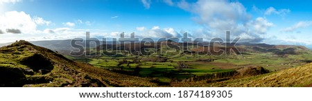 Panoramic shot of Sugar loaf in the distance with beautiful welsh scenary around it taken from skirrid fawr south wales uk.