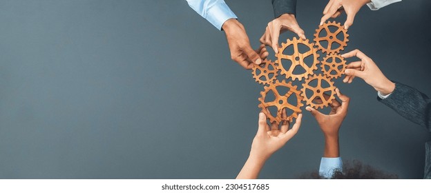 Panoramic shot top view of business people holding cog wheel as unity and teamwork in corporate workplace concept. Office worker colleague with symbol of visionary system for business success. Concord - Shutterstock ID 2304517685