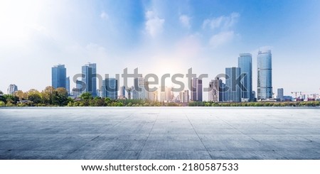 Panoramic sky and building with empty concrete square floor