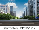 Panoramic skyline and buildings with empty road