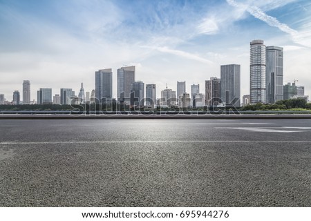 Panoramic skyline and buildings with empty road
