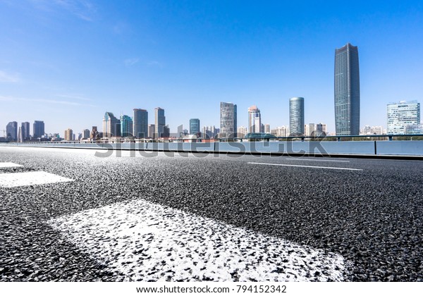 Panoramic\
skyline with empty road in shanghai\
china