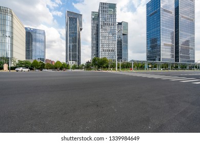 Panoramic skyline and modern business office buildings with empty road,empty concrete square floor - Shutterstock ID 1339984649