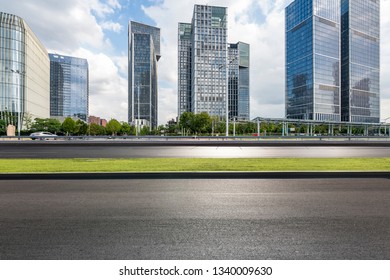 Panoramic skyline and modern business office buildings with empty road,empty concrete square floor - Shutterstock ID 1340009630