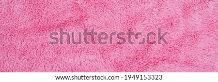Panoramic Soft pink fur texture. Rose color fluffy fur, fashion background. Decorative pink dyed sheepskin. Banner