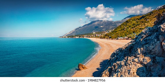 Panoramic Spring View Of Publik Beach In Dhermi Town. Colorful Morning Seascape Of Adriatic Sea. Attractive Spring Scene Of Albania, Europe. Traveling Concept Background.