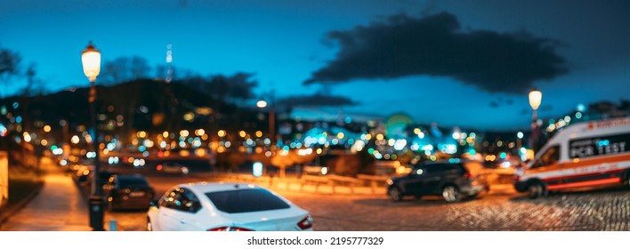 Panoramic Streetview Night Boke Bokeh Blurred Background. Blurred Boke Bokeh Background Of City Night Illumination. Abstract Blurred Bokeh Architectural Urban Backdrop.