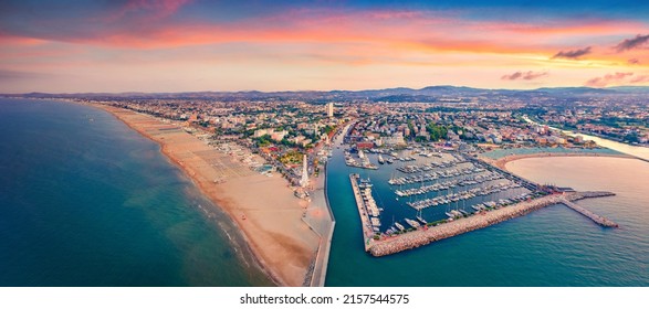 Panoramic summer view from flying drone of Libera Rimini public beach. Captivating evening scene of Italy, Europe. Colorful sunset on Adriatic coast. Vacation concept background. - Shutterstock ID 2157544575