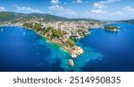 Panoramic summer view of the old harbor and town of Skiathos island, Sporades, Greece, with Bourtzi peninsula and Plakes area in front 