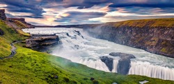 Panoramic Summer View Of Popular Tourist Destination - Gullfoss Waterfall. Dramatic Sunrise On Hvita River. Incredible Morning Scene Of Iceland, Europe. Traveling Concept Background.