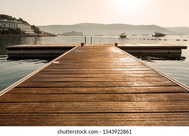 Panoramic Sunrise view of Bodrum Castle and marina bay on Turkish Riviera from old wooden docks. Bodrum is a district and a port city in Mugla Province, in Aegean Region of Turkey
 - Powered by Shutterstock