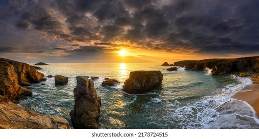 Panoramic sunset landscape over the sea coast. Sea coast at sunset. Sunset sea coast panorama. Sea coast sunset panoramic landscape