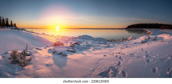 Panoramic Sunset Through The Horizon. Winter Wonderland Scenery In Scenic Golden Evening Light At Sunset With Clouds And Long Shadow. Tranquil Nature Copy Space Background.