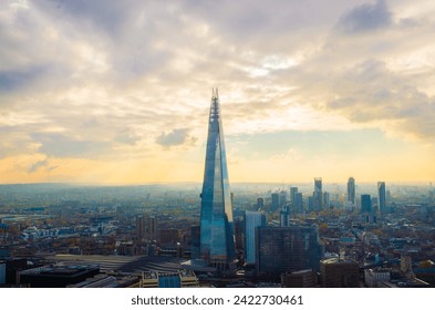 Panoramic sunset view from Sky Garden, London, featuring the Shard building amidst the cityscape. Urban beauty at dusk - Powered by Shutterstock