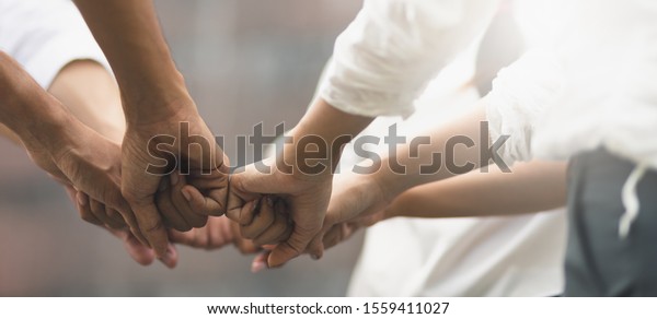 Panoramic teamwork business
join hand together concept, Business team standing hands together,
Volunteer charity work. People joining for cooperation success
business.