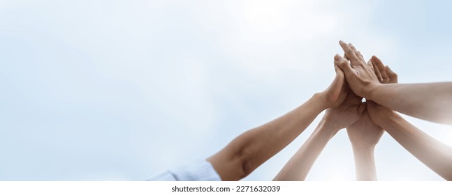 Panoramic Teamwork,empathy,partnership and Social connection in business join hand together concept.Hand of diverse people connecting.Power of volunteer charity work,Stack of people hand. - Shutterstock ID 2271632039