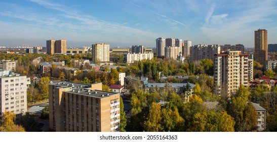 Panoramic Top View Of Modern City Houses Among Autumn Trees With Colorful Foliage And Blue Sky On A Clear October Day. Concept Urban Landscape In Reutov, Moscow Region And Copy Space