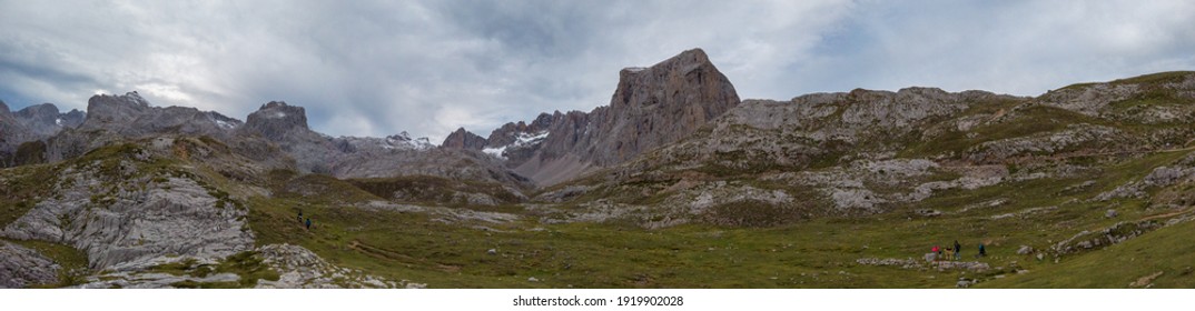 Panoramic upper start section of hiking track PR-PNP 24 to the magnificient summits of Mounts Pena Remona, Torre de Salinas, La Padierna and Pico de San Carlos at Picos de Europa National Park, Spain.