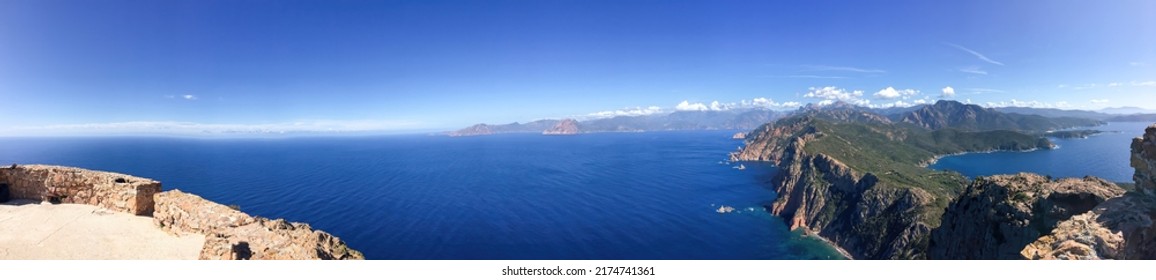 Panoramic View From Above Of The Corsica Coast Of The Mediterranean Blue Sea In Summer