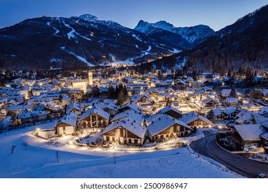 Panoramic view from above at nightfall of the snowy village of Bardonecchia, a ski resort in the Alps in Piedmont, Italy. - Powered by Shutterstock