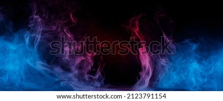 Panoramic view of the abstract fog. Red cloudiness, mist or smog moves on black background. Beautiful swirling blue smoke. Mockup for your logo. Wide angle horizontal wallpaper or web banner.