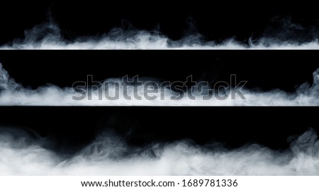 Panoramic view of the abstract fog or smoke move on black background. White cloudiness, mist or smog background. 
