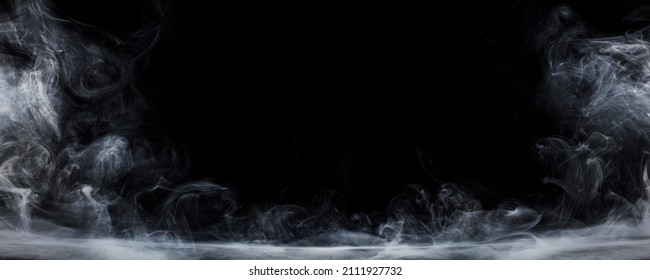 Panoramic view of the abstract fog. White cloudiness, mist or smog moves on black background. Beautiful swirling gray smoke. Mockup for your logo. Wide angle horizontal wallpaper or web banner.