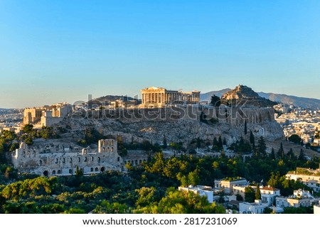 Panoramic view of The Acropolis of Athens, Greece, with the Parthenon Temple with colorful clouds at  sunset time. Athens, Greece, Europe