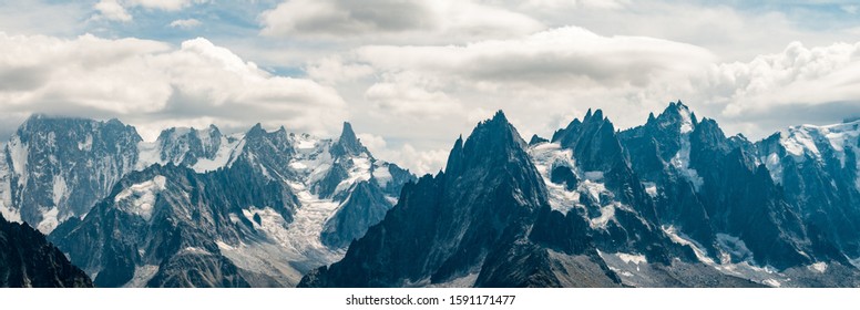 Panoramic view across the Vallee Blanch and Mere de Glace with the mountains above Chamonix, Mont Blanc massif and clouds. - Shutterstock ID 1591171477