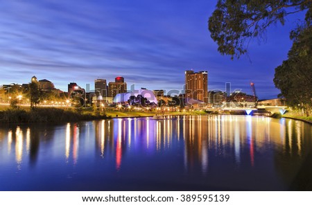 panoramic view of Adelaide's CBD reflecting in still torrens river waters with bright lights and illumination