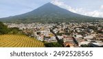 Panoramic view of the Agua volcano and the town of Ciudad Vieja in Guatemala