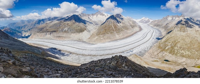 Panoramic view of Aletsch glacier from Eggishorn in Switzerland. Called Aletschgletscher in german, it is the largest glacier in the Alps and Europe. - Shutterstock ID 2211078539