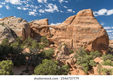 Panoramic view along the Devils Garden Trail with Double O Arch in Arches National Park in Utah
