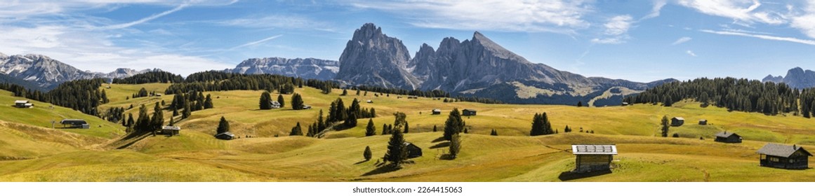 Panoramic view of Alpe di Siusi (Seiser Alm) in italian Dolomites. Ultra wide panorama. South Tyrol, Dolomites, Alps, Italy. - Powered by Shutterstock