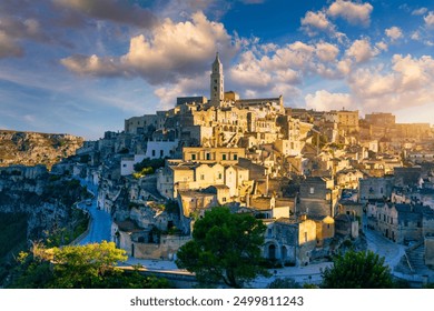 Panoramic view of the ancient town of Matera (Sassi di Matera) in a beautiful autumn day, Basilicata, southern Italy. Stunning view of the village of Matera. Matera is a city on a rocky outcrop. - Powered by Shutterstock