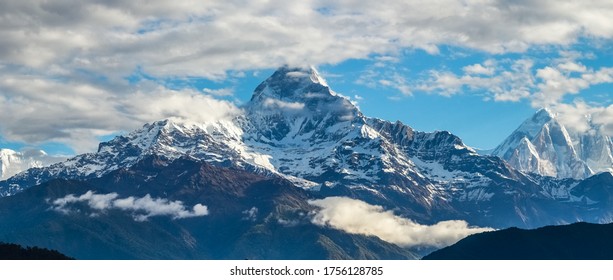 Panoramic view of Annapurna Mountain Range viewed from Pokhara city showing Mt. Fishtail or, Mt. Machchapuchhre, Himchuli and Annapurna mountains covered with snow.