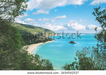 Panoramic view of Arrabida beach. Rocky seascape on a sunny day. Creiro beach. Setubal region, Atlantic Ocean, Portugal