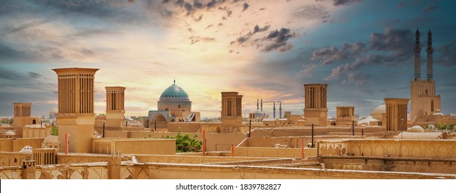 Panoramic view of badgirs and mosques of Yazd on a cloudy day, in Iran